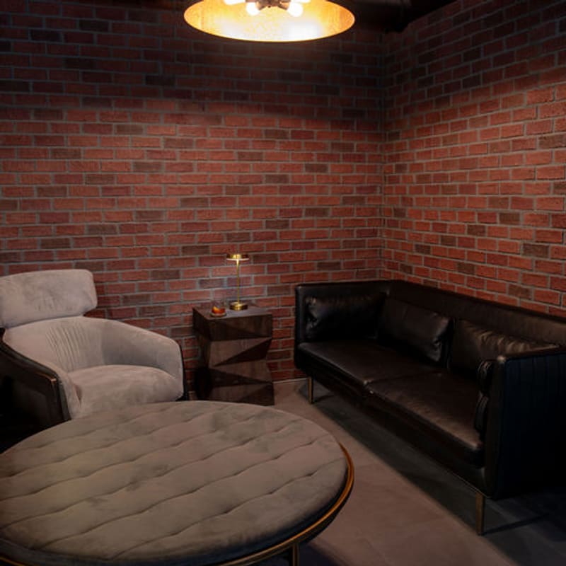 A private brick-walled booth off the main lounge
