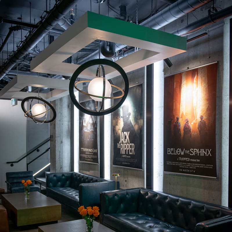Booth seating along the poster wall in the lounge